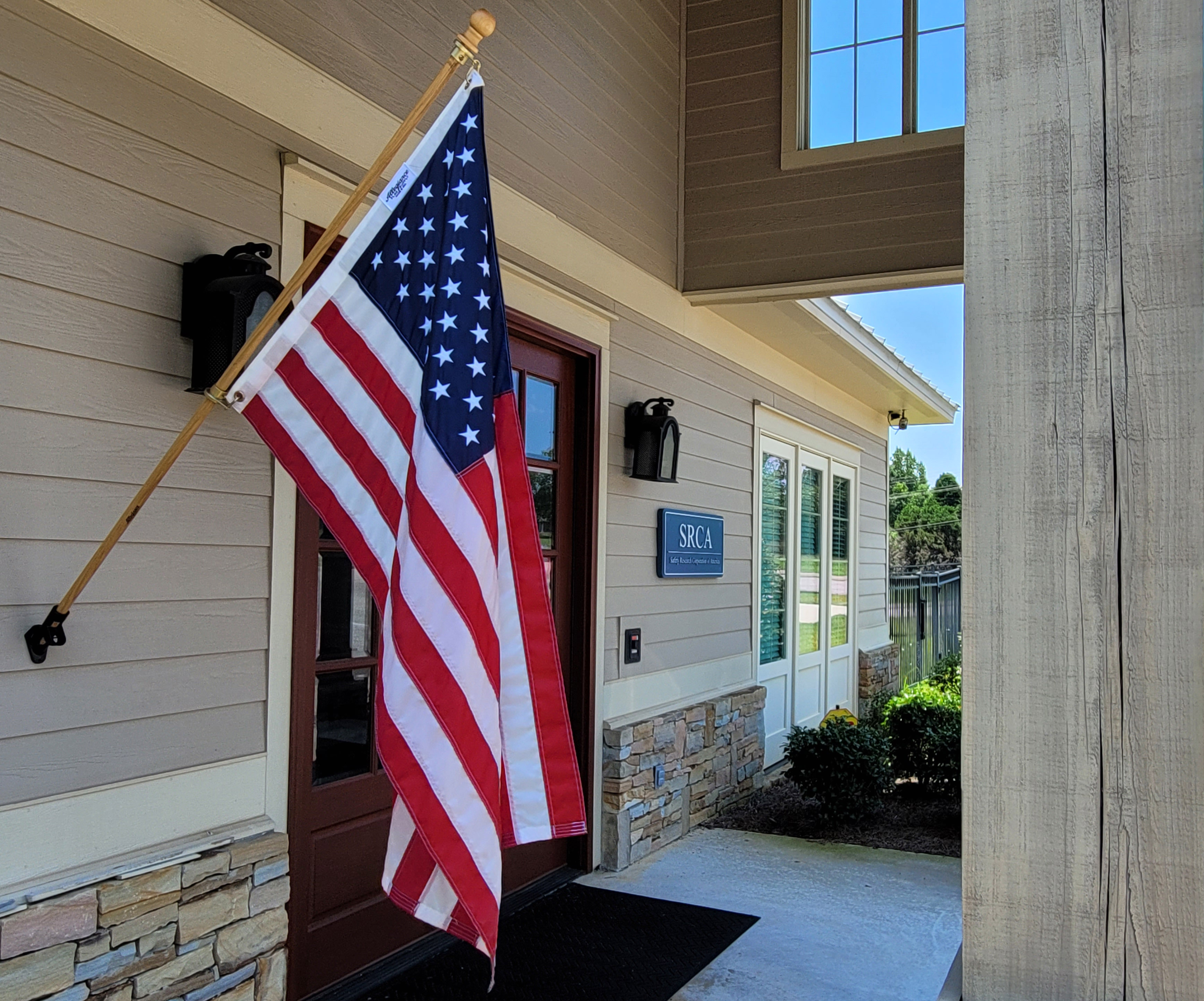 Side view of front door of SRCA with American flag in front of it